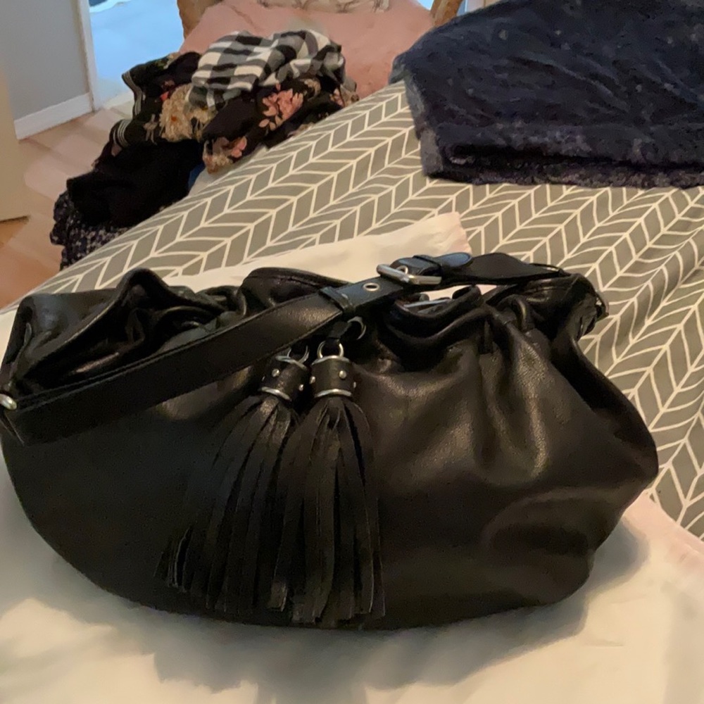 Loft leather hobo bag with tassles.